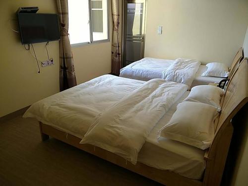 Imagen de la habitación del Huanxing Inn. Foto 8