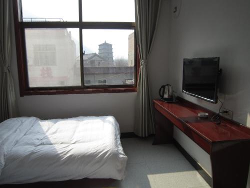 Imagen de la habitación del Huashan Jiulong Guesthouse. Foto 3