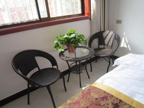 Imagen de la habitación del Huashan Jiulong Guesthouse. Foto 4