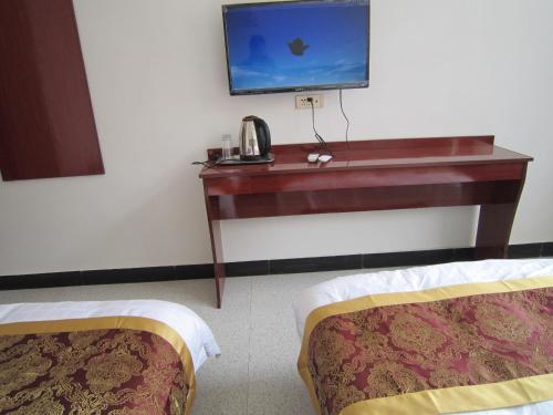 Imagen de la habitación del Huashan Jiulong Guesthouse. Foto 5