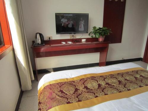 Imagen de la habitación del Huashan Jiulong Guesthouse. Foto 6