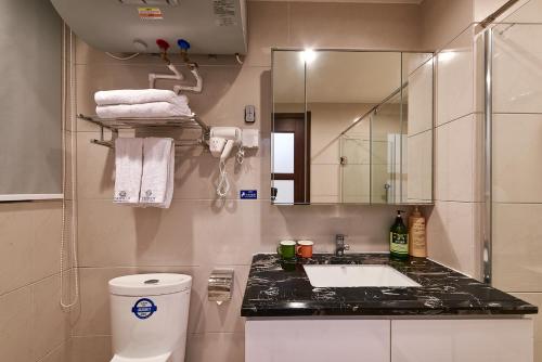 Imagen de la habitación del Hui Jin Inn Suites. Foto 9