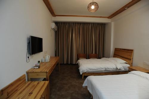 Imagen de la habitación del Huishu Renjia Inn. Foto 6