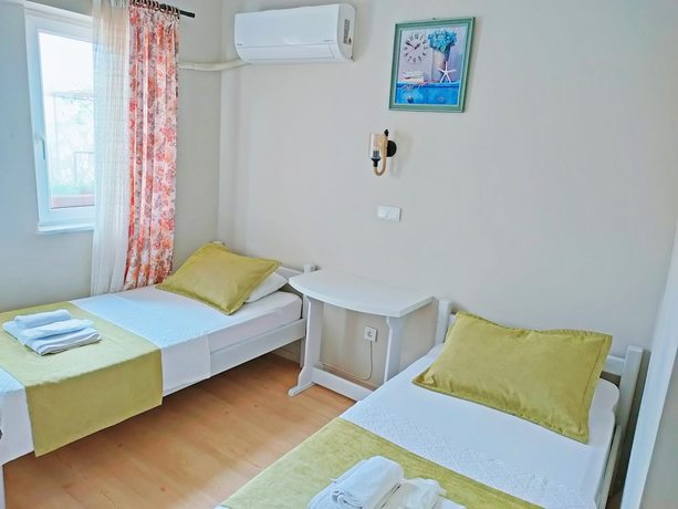 Imagen de la habitación del Ilyada Hotel. Foto 7