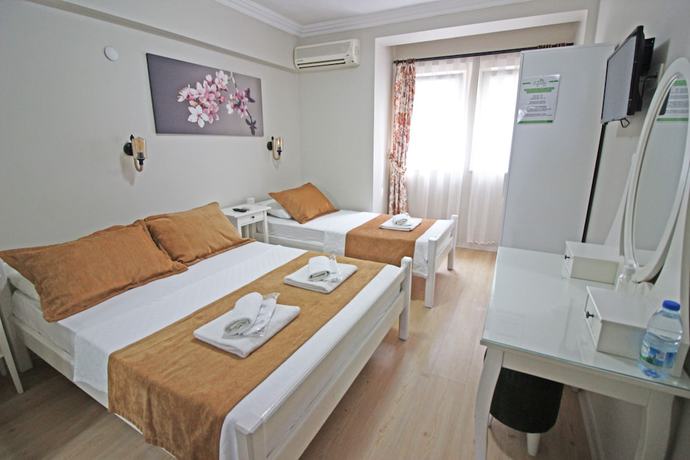 Imagen de la habitación del Ilyada Hotel. Foto 10