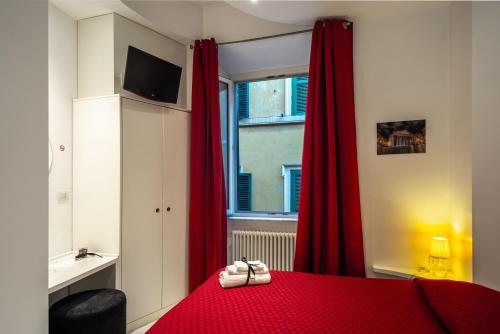 Imagen de la habitación del Intra' Residenza in Trastevere. Foto 14