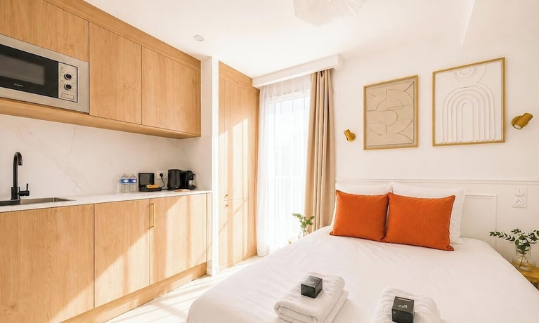 Imagen de la habitación del JIJI Suites. Foto 11