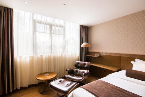 Imagen de la habitación del James Joyce Hotel Guangzhou Sanyuanli Subway Stati. Foto 5