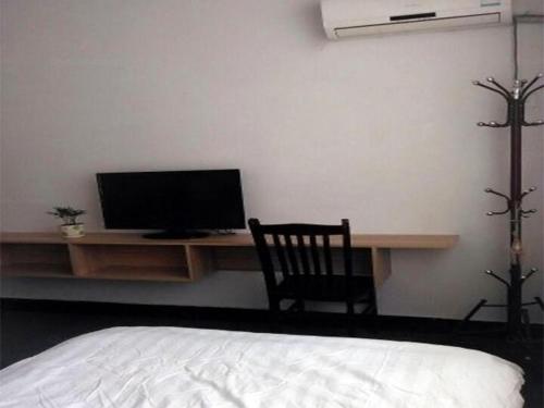 Imagen de la habitación del Jianglin Xiaojiang Inn. Foto 8