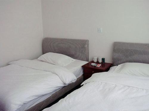 Imagen de la habitación del Jianglin Xiaojiang Inn. Foto 9