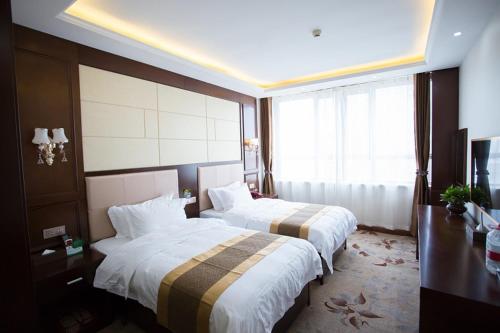 Imagen de la habitación del Jinren Holiday Hotel. Foto 6