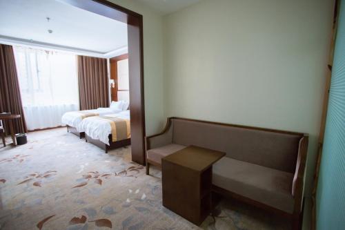 Imagen de la habitación del Jinren Holiday Hotel. Foto 9