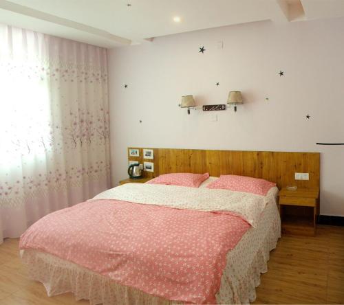 Imagen de la habitación del Jinsanjiao Guesthouse. Foto 5