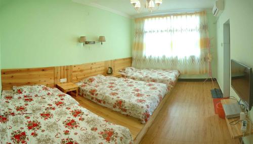 Imagen de la habitación del Jinsanjiao Guesthouse. Foto 7