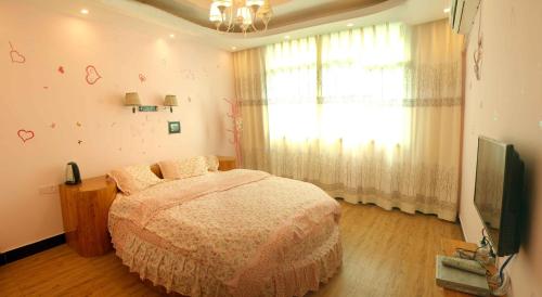 Imagen de la habitación del Jinsanjiao Guesthouse. Foto 8