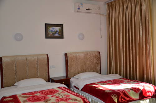 Imagen de la habitación del Jiuzhaigou Xiangxie Inn. Foto 4