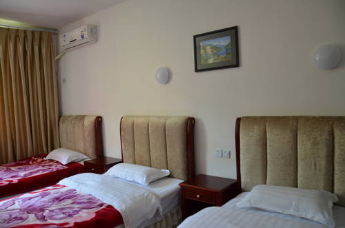 Imagen de la habitación del Jiuzhaigou Xiangxie Inn. Foto 11