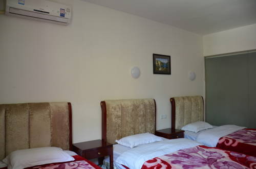 Imagen de la habitación del Jiuzhaigou Xiangxie Inn. Foto 13