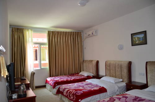 Imagen de la habitación del Jiuzhaigou Xiangxie Inn. Foto 14