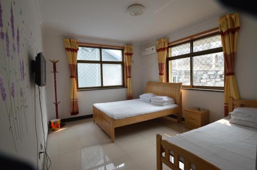 Imagen de la habitación del Juxingyuan Villa. Foto 7