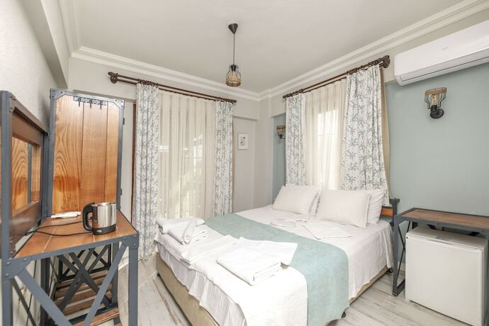 Imagen de la habitación del K Bozcaada Paralia. Foto 17