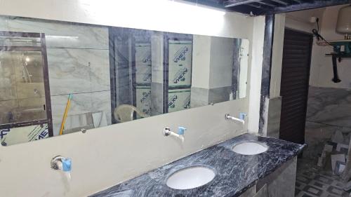 Imagen de la habitación del KSHIPRA GUEST HOUSE. Foto 15
