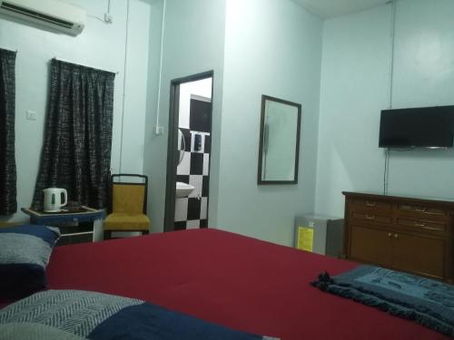 Imagen de la habitación del Kamar Musafir MMS. Foto 14