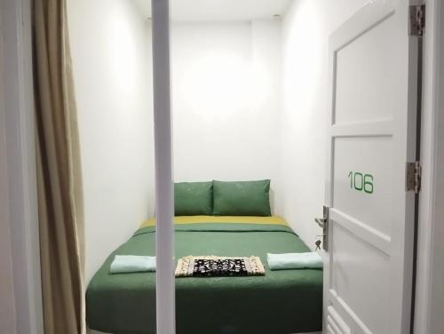 Imagen de la habitación del Kareem Syariah Hostel Bukittinggi. Foto 10