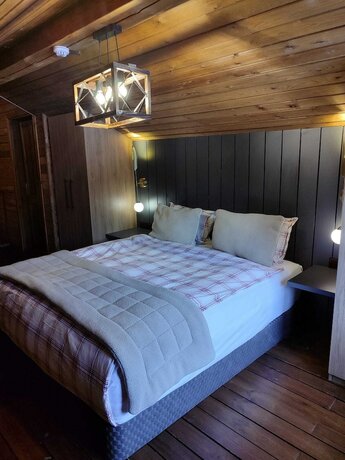 Imagen de la habitación del Karinna Forest Houses. Foto 18
