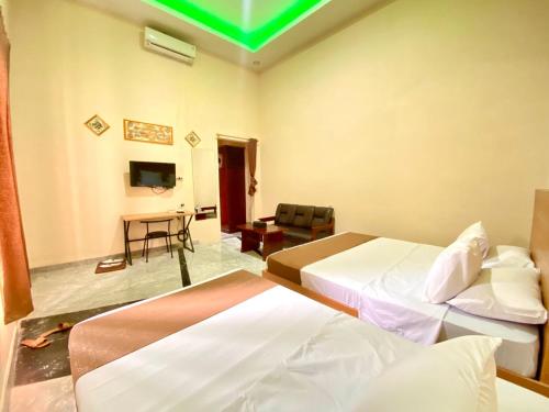 Imagen de la habitación del Kelud Syariah Guesthouse. Foto 12