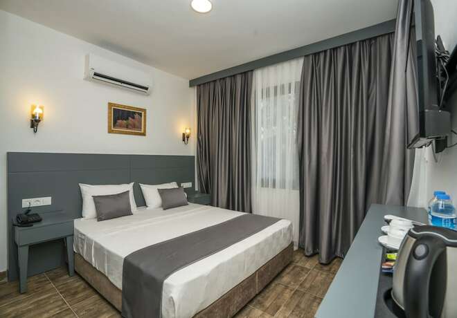 Imagen de la habitación del Kensington Kerdime Beach Hotel. Foto 11