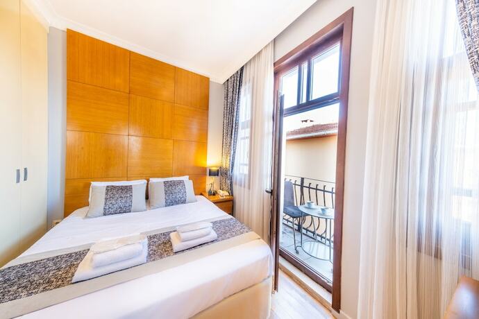 Imagen de la habitación del King Suits Hotel. Foto 18
