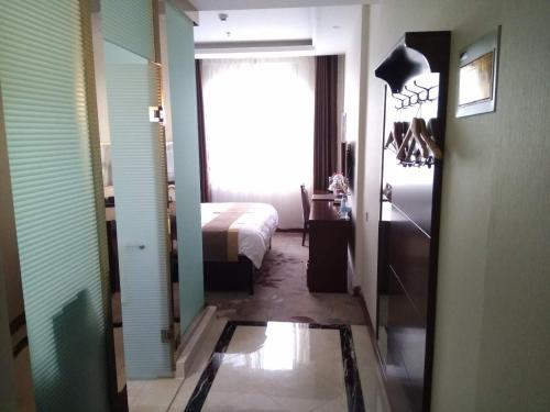 Imagen general del Kuerle Jinrun Holiday Hotel Airport Road. Foto 1