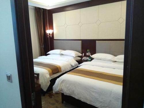 Imagen de la habitación del Kuerle Jinrun Holiday Hotel Airport Road. Foto 9