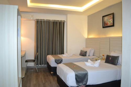 Imagen de la habitación del Kurnia perdana Hotel. Foto 20