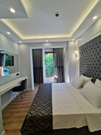 Imagen de la habitación del LUXX GARDEN HOTEL. Foto 18