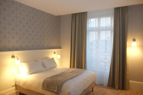 Imagen general del La Maison Blanche – Appart’hôtels Climatisés De Charme Chic Et Cosy – Centre-ville. Foto 2