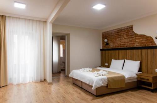 Imagen de la habitación del La Pera Suites. Foto 11