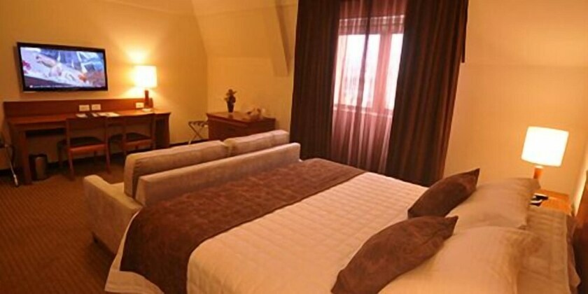 Imagen de la habitación del Laghetto Villa Moura. Foto 29
