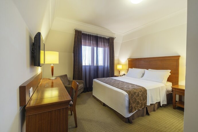 Imagen de la habitación del Laghetto Villa Moura. Foto 30