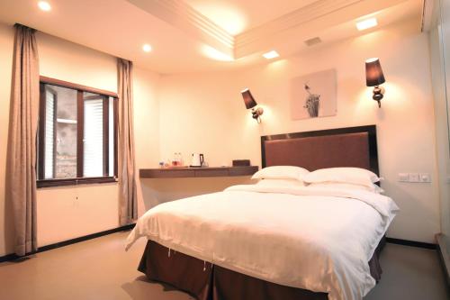 Imagen de la habitación del Lagom Gulangyu Stay Boutique Inn. Foto 3