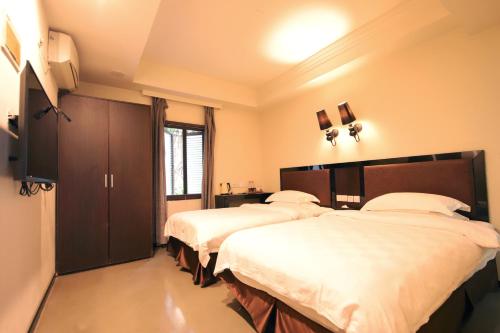 Imagen de la habitación del Lagom Gulangyu Stay Boutique Inn. Foto 4