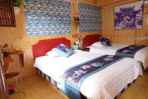 Imagen de la habitación del Langzhong Ancient Town Qinyou Inn. Foto 9