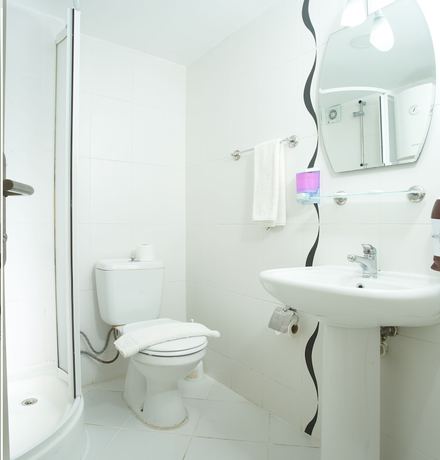 Imagen de la habitación del Larimar Suite Hotel. Foto 14
