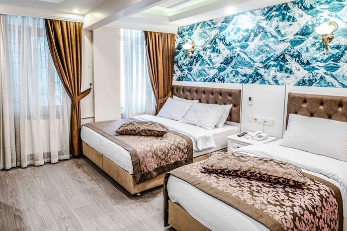 Imagen de la habitación del Lazz City Hotel. Foto 17