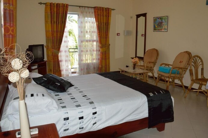 Imagen de la habitación del Le Capricorne Villas. Foto 17