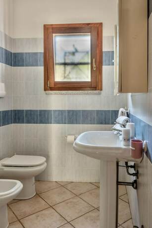 Imagen de la habitación del Le Dimore di Budoni WIFI e A.C. Foto 13