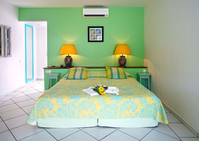 Imagen de la habitación del Le Domaine Anse Marcel Beach Resort. Foto 6