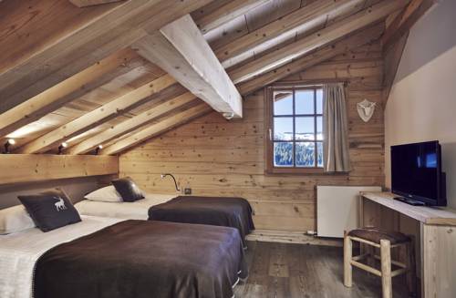 Imagen de la habitación del Le Lodge Chasse Montagne. Foto 14