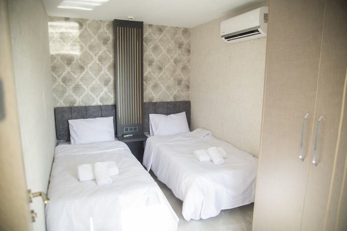 Imagen de la habitación del Le Luxe suites hotel and SPA. Foto 7